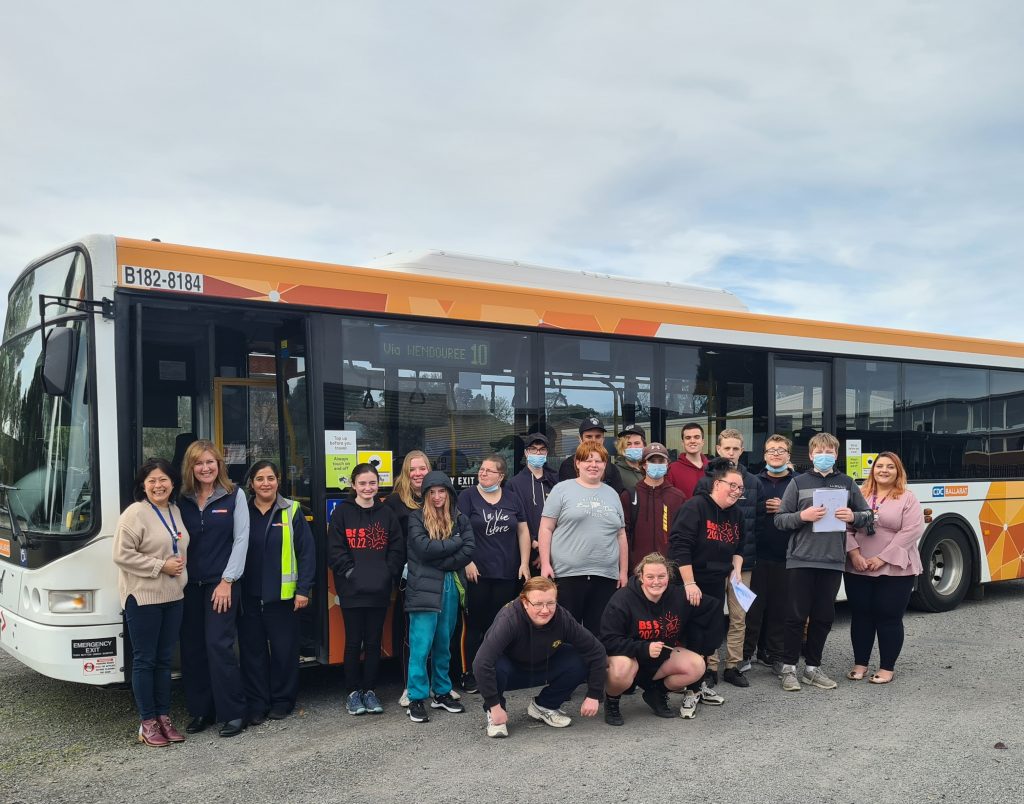 Participants Standing In Front Of CDC VIC Bus