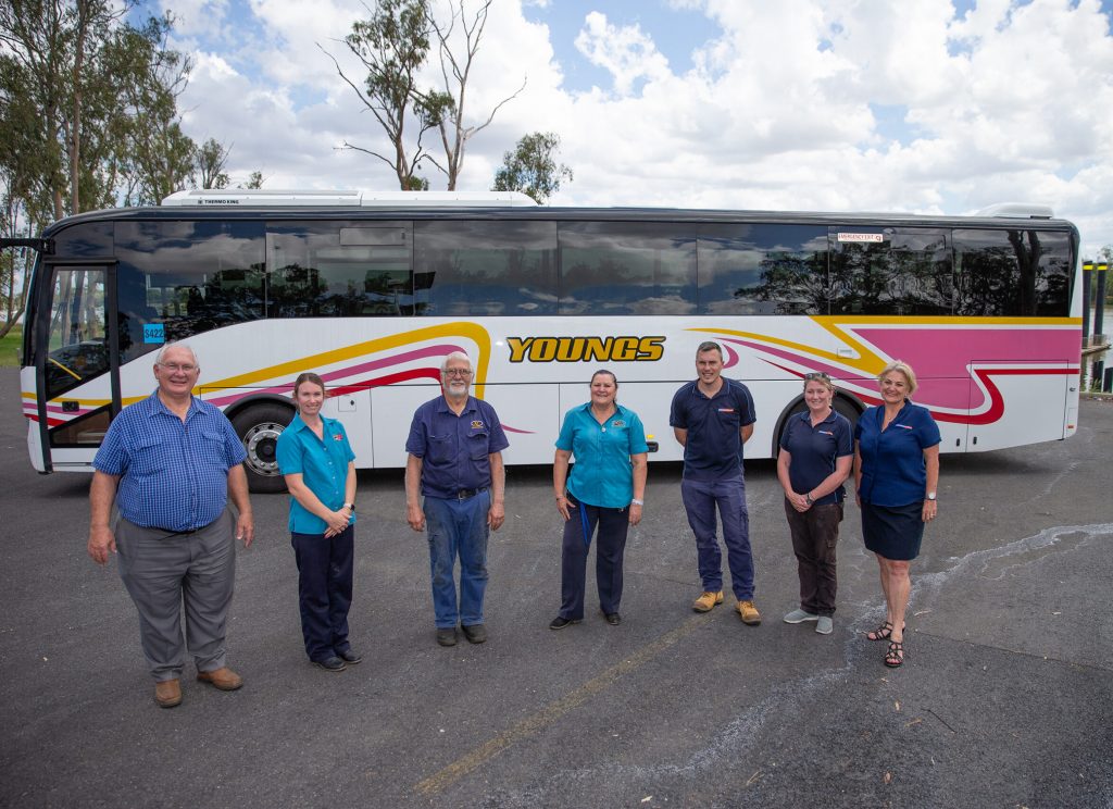 Youngs Group Staff Standing In Front Of A Bus